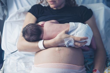 Woman holding newborn baby