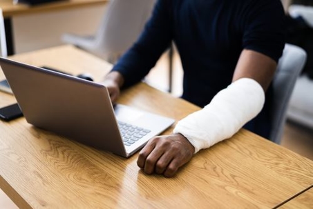 man injured at a computer