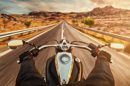 person riding a motorcycle on a highway