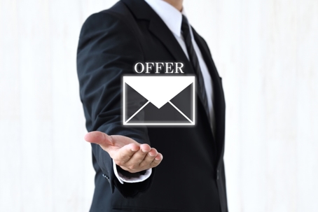 Business man's hand and envelope pictogram with OFFER word