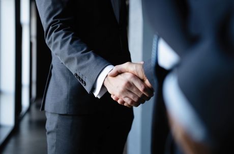 lawyers shaking hands with a client
